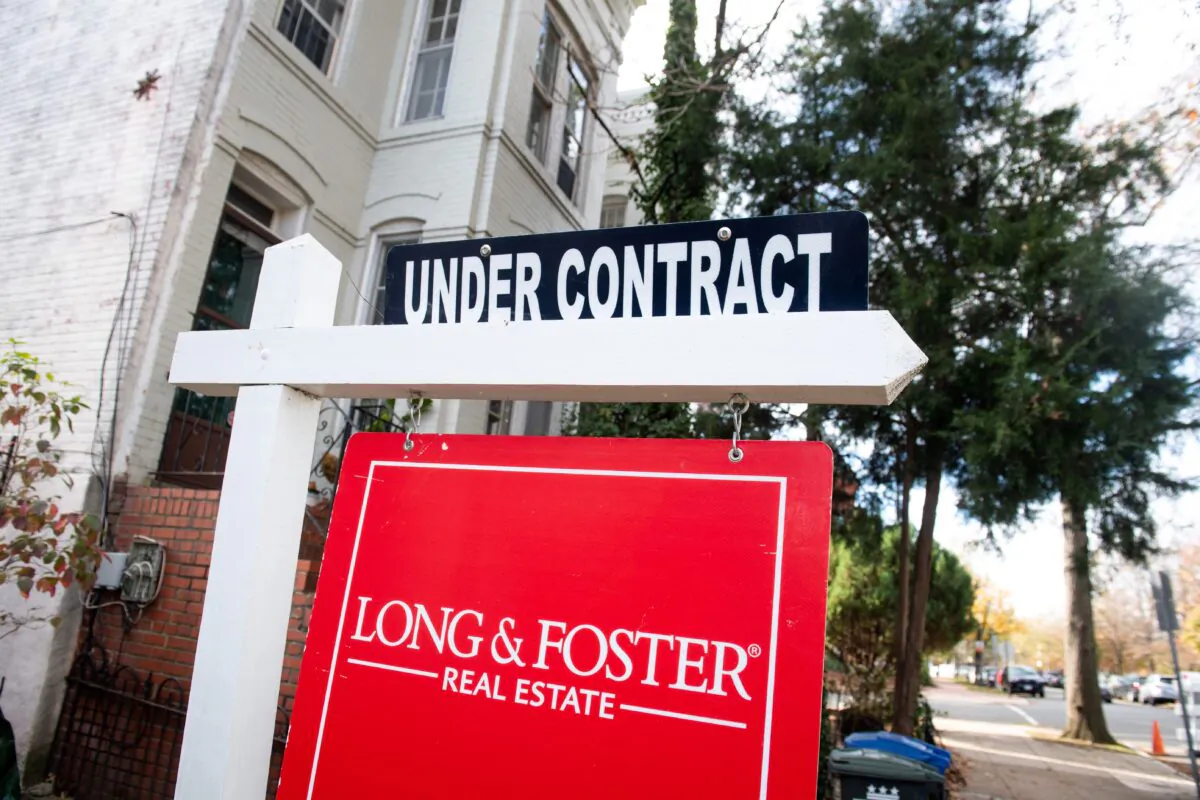 A house's real estate for sale sign shows the home as being "Under Contract" in Washington on Nov. 19, 2020. (Saul Loeb/AFP via Getty Images)