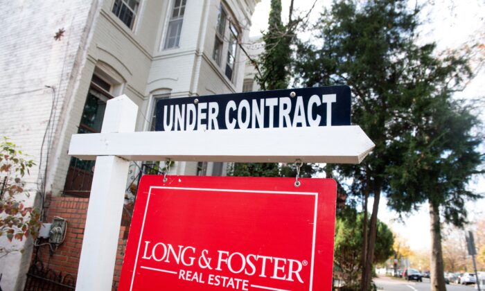 A house's real estate for sale sign shows the home as being "Under Contract" in Washington on Nov. 19, 2020. (Saul Loeb/AFP via Getty Images)