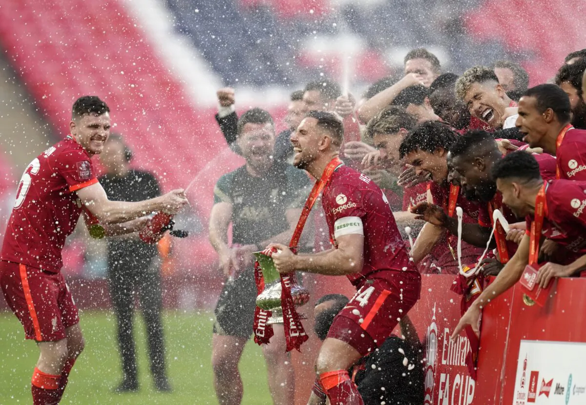 Liverpool players celebrate at the end of the English FA Cup final soccer match between Chelsea and Liverpool, at Wembley stadium in London on May 14, 2022. (Kirsty Wigglesworth/AP Photo)
