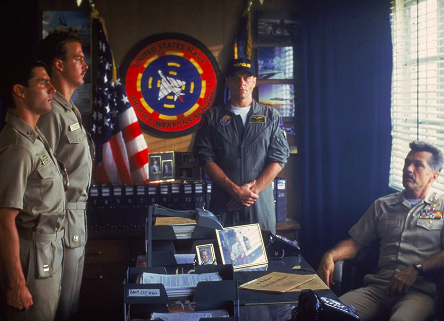 four men in Navy office in TOP GUN
