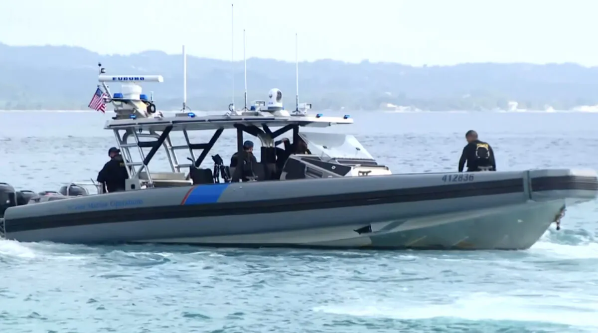A U.S. Customs and Border Protection boat off Puerto Rico on May 13, 2022, after a suspected migrant boat capsized west of Puerto Rico on May 12, 2022,  in a still from video. (WAPA via AP/Screenshot via The Epoch Times)