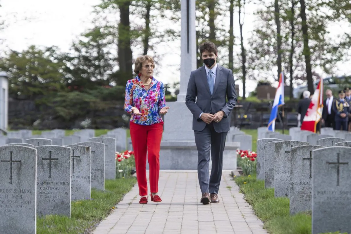 Princess Margriet of the Netherlands and Prime Minister Justin Trudeau walk after participating in a ceremony at the National Military Cemetery at Beechwood in Ottawa, on May 13, 2022. (The Canadian Press/Justin Tang)