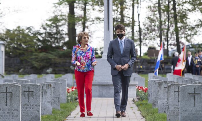 Princess Margriet of the Netherlands and Prime Minister Justin Trudeau walk after participating in a ceremony at the National Military Cemetery at Beechwood in Ottawa, on May 13, 2022. (The Canadian Press/Justin Tang)