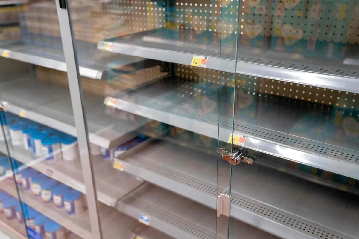 Grocery store shelves where baby formula is typically stocked are locked and nearly empty in Washington, D.C., on May 11, 2022. (Stefani Reynolds/AFP via Getty Images)