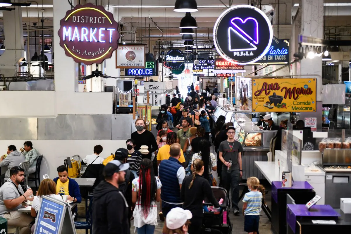 Customers browse food stalls inside Grand Central Market in downtown Los Angeles on March 11, 2022. Fears of stagflation in the U.S. economy are on the rise. Stagflation happens when the economy has slow growth, unemployment has risen to record heights, and prices are rising, or the country is in an inflationary stage.(Patrick T. Fallon/AFP via Getty Images)