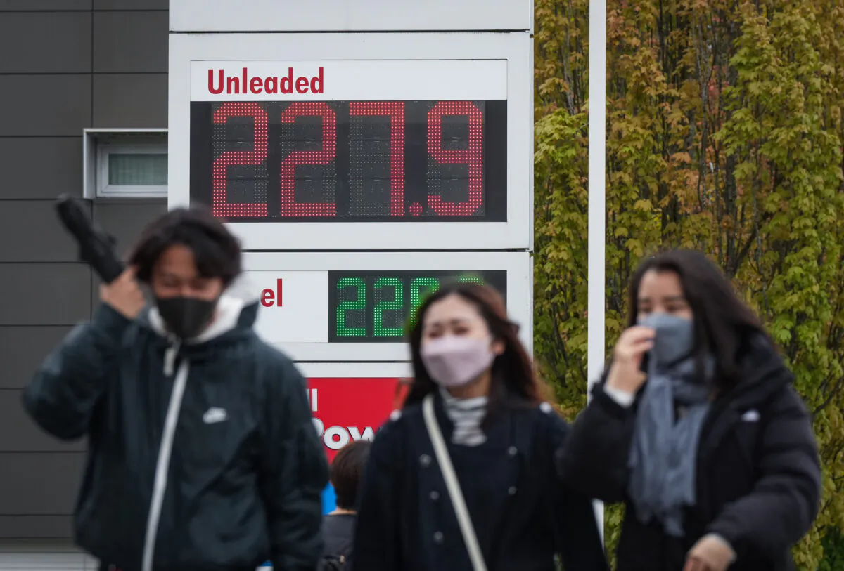 A sign at a gas station displays the price of a litre of regular grade gasoline after it reached a new high of $2.28 in Vancouver on May 14, 2022. (The Canadian Press/Darryl Dyck)