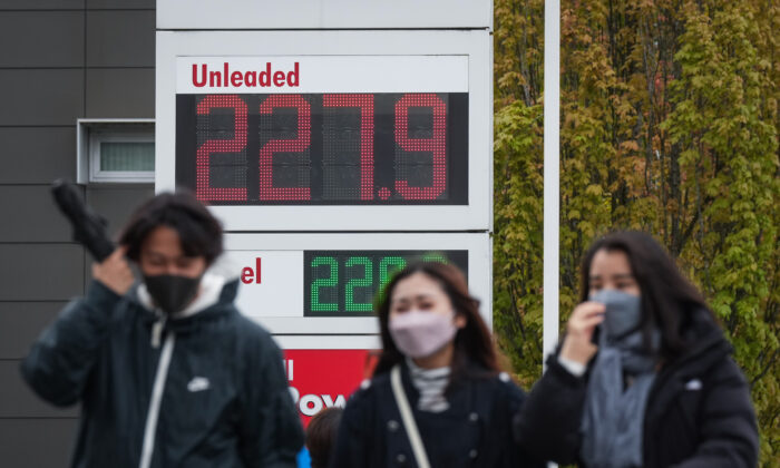 A sign at a gas station displays the price of a litre of regular grade gasoline after it reached a new high of $2.28 in Vancouver on May 14, 2022. (The Canadian Press/Darryl Dyck)