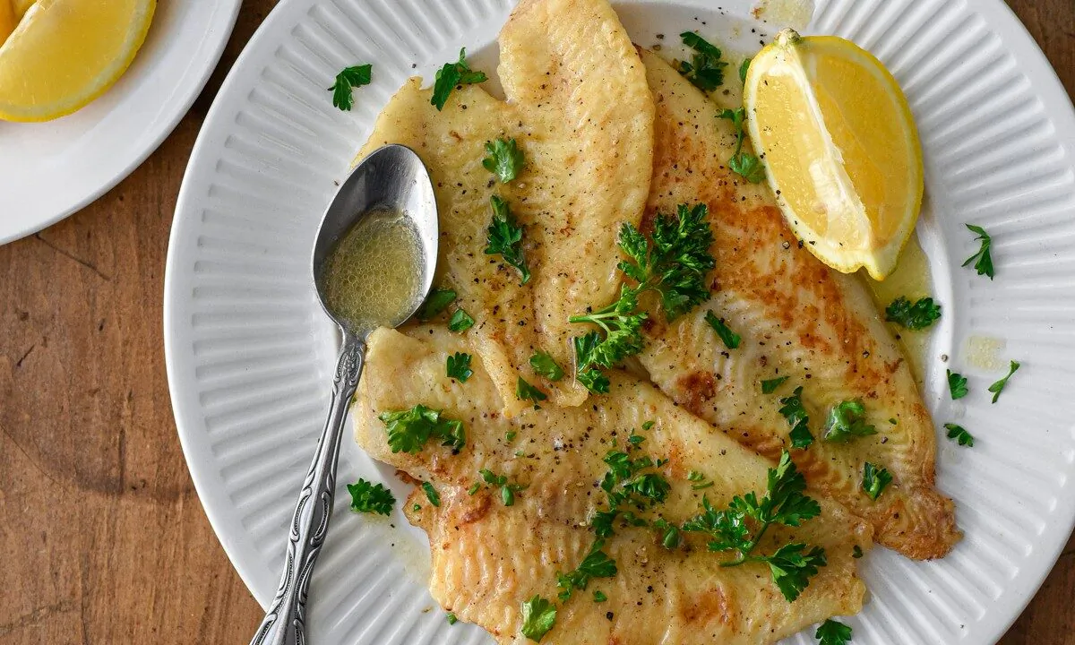 Delicate Dover sole, simply dredged and pan-fried, is finished with a bath of bright lemon-brown butter sauce. (Audrey Le Goff)