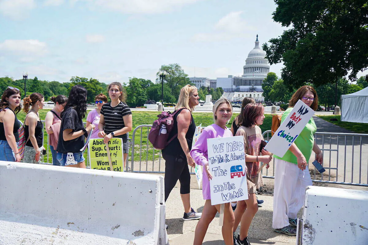 Teenage children attend an abortion protest outside the U.S. Capitol in Washington, D.C. on May 15, 2022 (Jackson Elliott/The Epoch Times)
