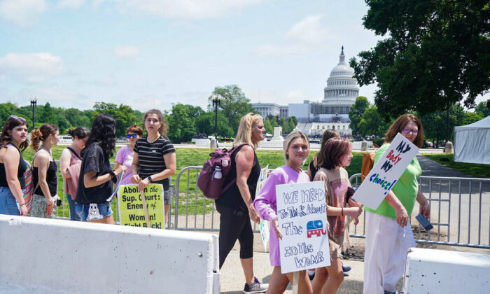 Teenage children attend an abortion protest outside the U.S. Capitol in Washington, D.C. on May 15, 2022 (Jackson Elliott/The Epoch Times)