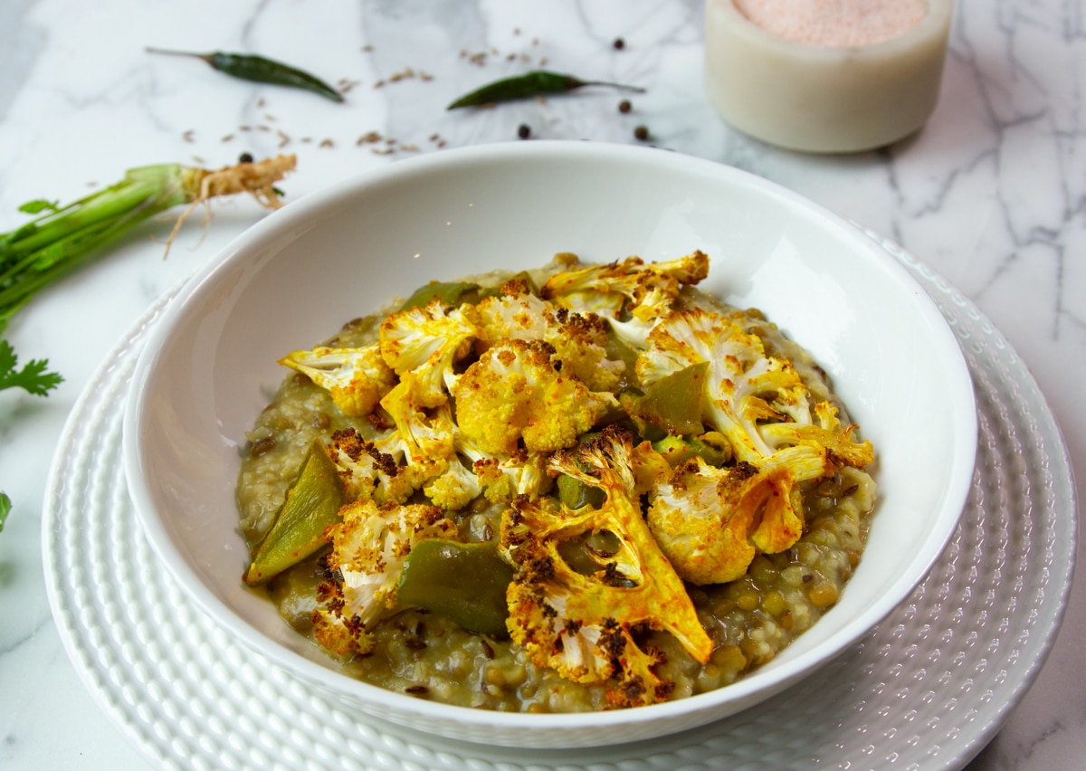 Khichdi with a roasted cauliflower and green pepper topping dusted with turmeric.
