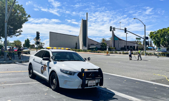 An Orange County Sheriff's Department car is parked outside of Geneva Presbyterian Church after a shooting left one dead and four critically injured in Laguna Woods, Calif., on May 15, 2022. (Vanessa Serna/The Epoch Times)