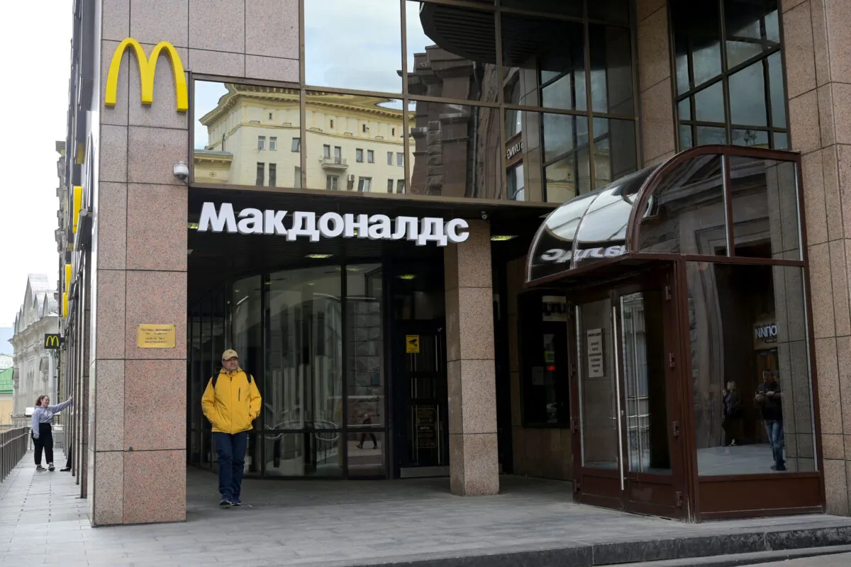 A man walks past a closed McDonald's restaurant in Moscow on May 16, 2022. (Natalia Kolesnikova/AFP via Getty Images)