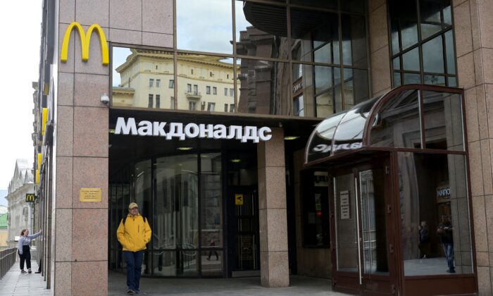 A man walks past a closed McDonald's restaurant in Moscow on May 16, 2022. (Natalia Kolesnikova/AFP via Getty Images)