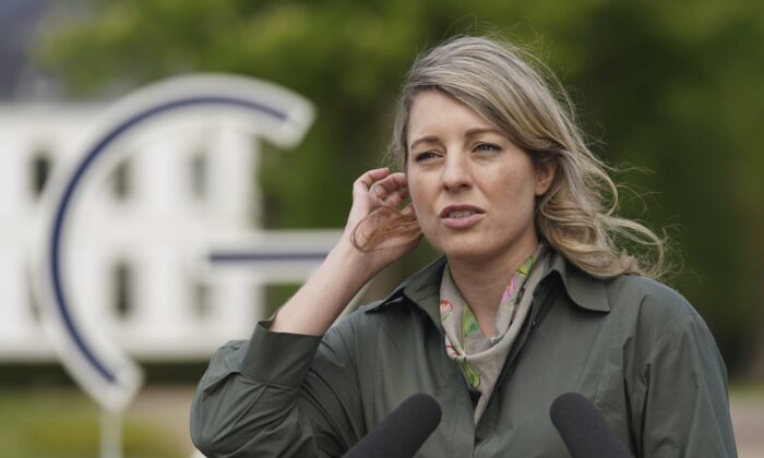 Melanie Joly, Foreign Minister of Canada, addresses the media during a connection    arsenic  portion  of the gathering  of overseas   ministers of the G7 Group of starring  antiauthoritarian  economical  powers astatine  the Weissenhaus edifice   successful  Weissenhaeuser Strand, Germany, May 14, 2022. (The Canadian Press/Pool via AP)