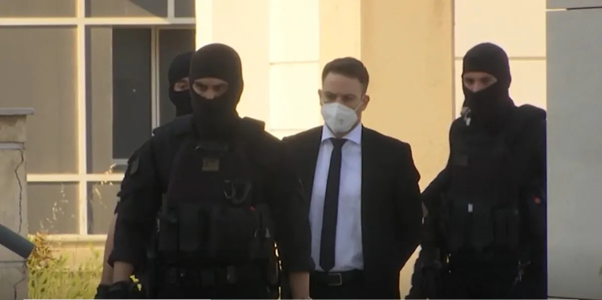 A Greek pilot and flight instructor, arrived at Greece court under heavy police guard on May 16, 2022. (AP/Screenshot via The Epoch Times)