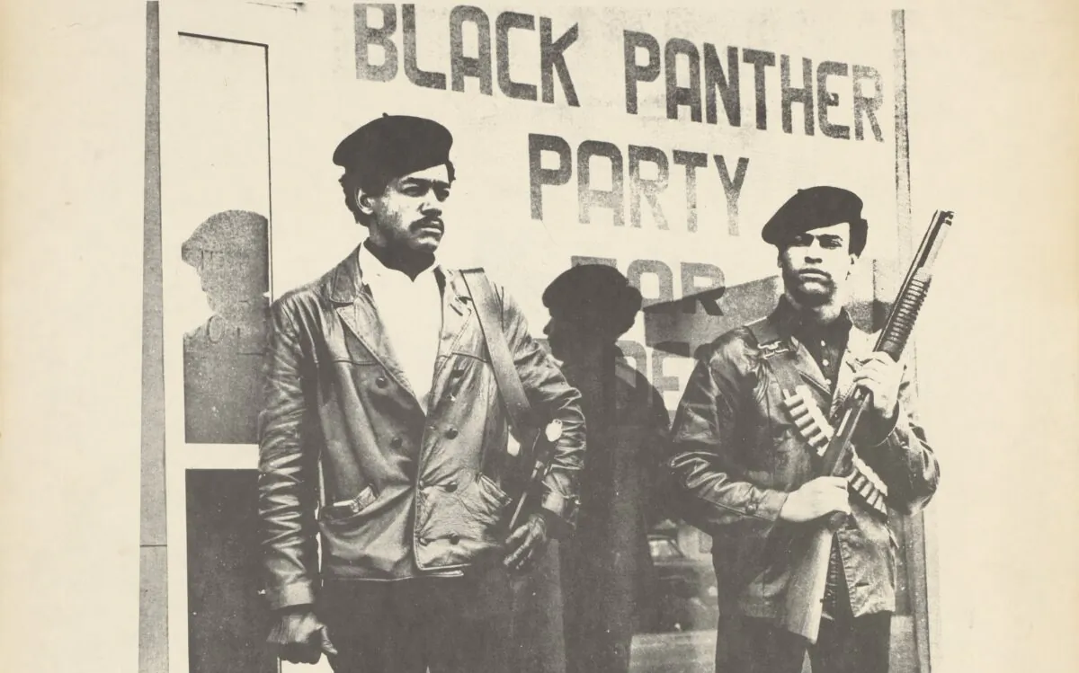 Black and white poster of Huey Newton (R) and Bobby Seale in front of the storefront headquarters of the Black Panther Party in Oakland, Calif. (Public Domain)