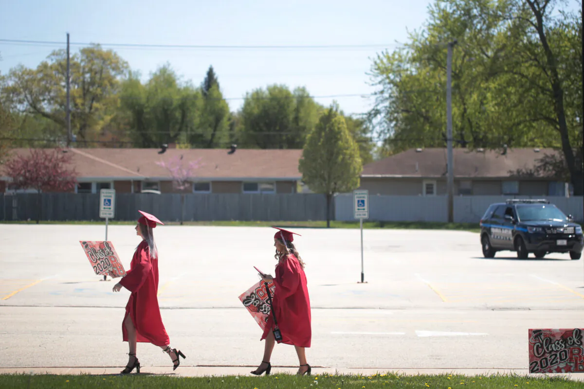 Students leave a graduation ceremony at a high school in Illinois on May 6, 2020. (Scott Olson/Getty Images)