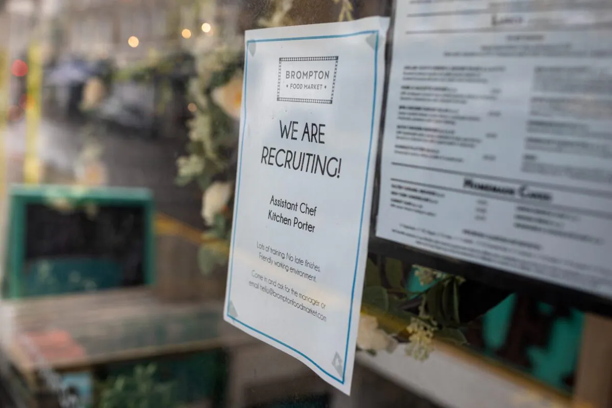 A "We are recruiting!" sign is seen in the window of a cafe in South Kensington in London, on June 4, 2021. (Rob Pinney/Getty Images)