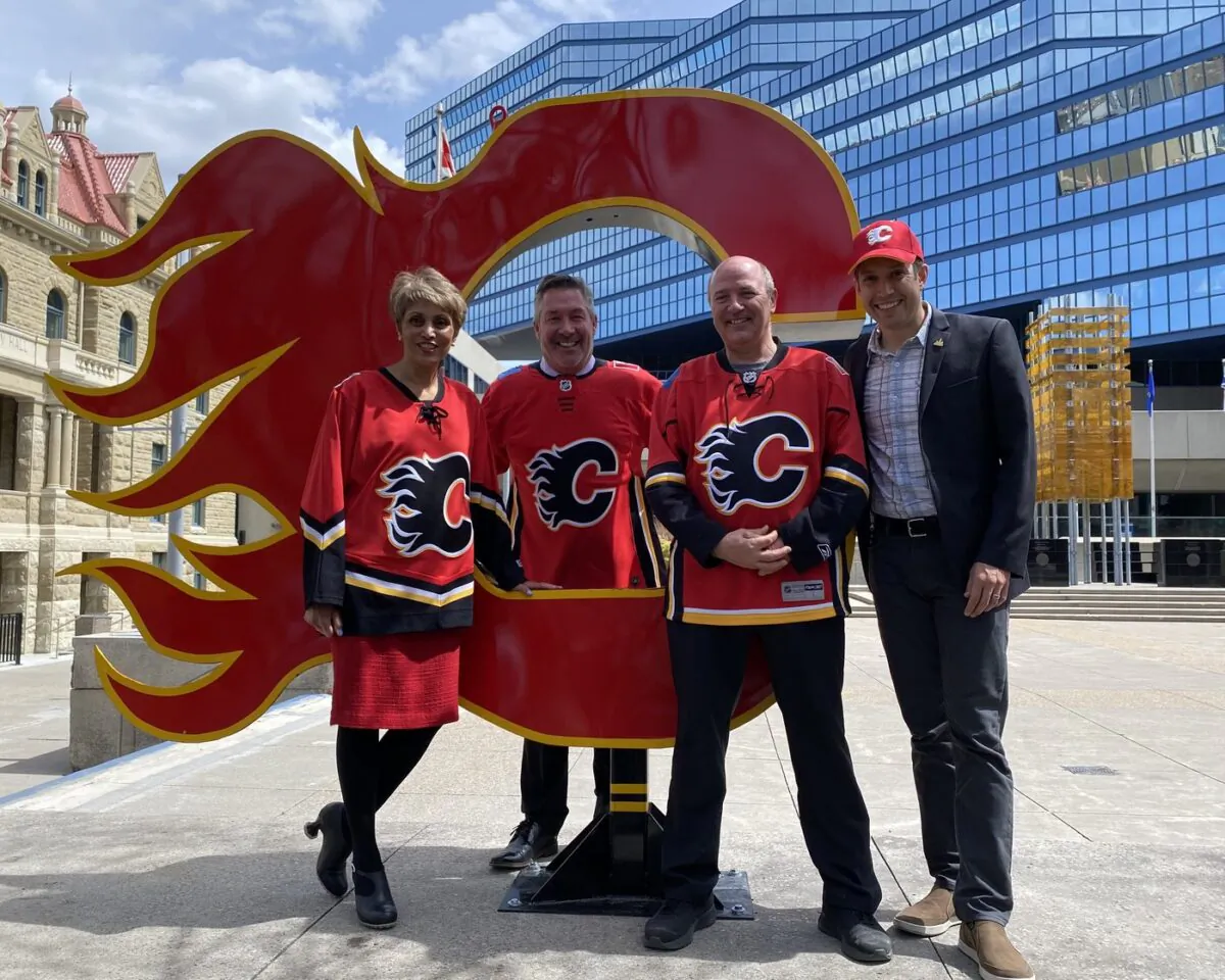 Calgary Mayor Jyoti Gondek, Coun. Dan McLean, Coun. Peter Demong and Coun. Evan Spencer (left to right) pose at Calgary City Hall on May 16, 2022. (The Canadian Press/Colette Derworiz)