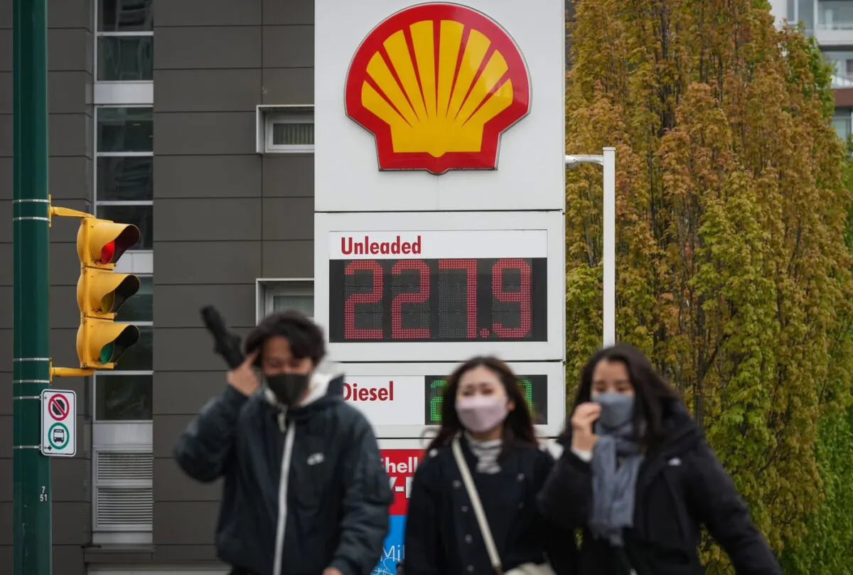 A sign at a gas station displays the price of a litre of regular grade gasoline after it reached a new high of $2.28 in Vancouver on May 14, 2022. (The Canadian Press/Darryl Dyck)