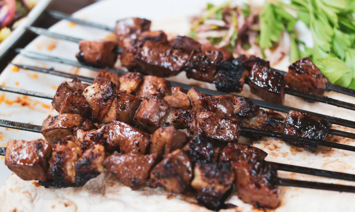 The orange, cumin and yogurt come together on the grill to lightly caramelize the meat. (Dreamstime/TNS)