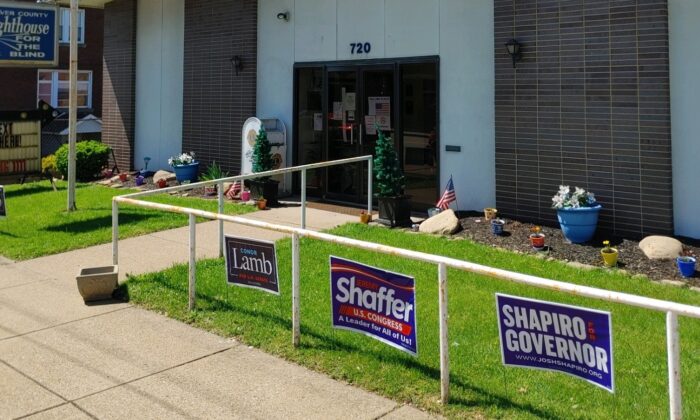 Lawn signs in New Brighton, Pennsylvania, on May 17, 2022. (Jeff Louderback/The Epoch Times)