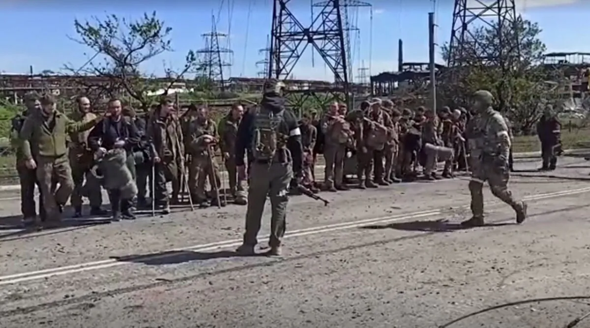 Ukrainian soldiers who had been holed up in the Azovstal steel plant leave Mariupol, Ukraine, on May 18, 2022. (Russian Defense Ministry via Reuters/Screenshot via The Epoch Times)