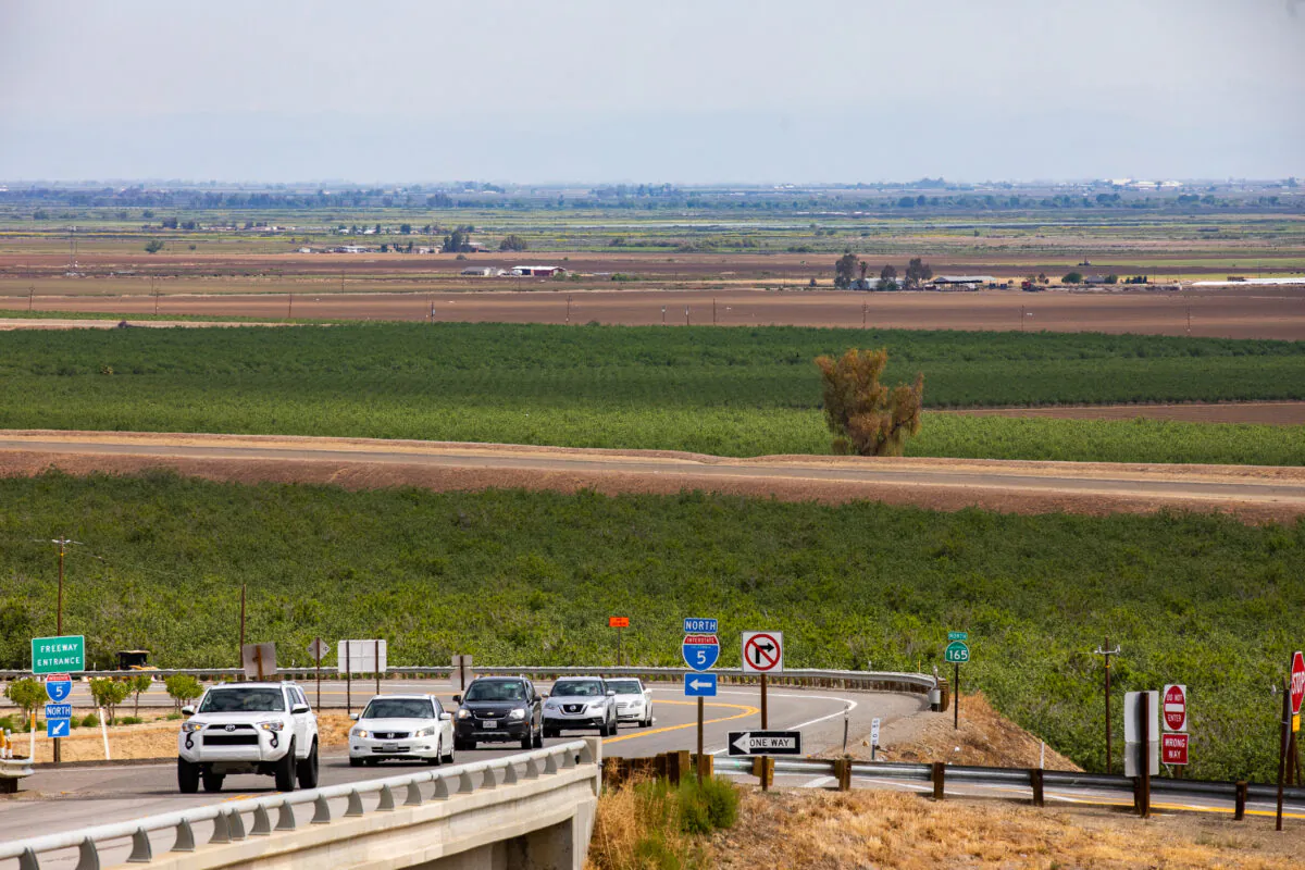 Cars drive away from the California Aquaduct outside of Sacramento, Calif., on April 19, 2022. (John Fredricks/The Epoch Times)