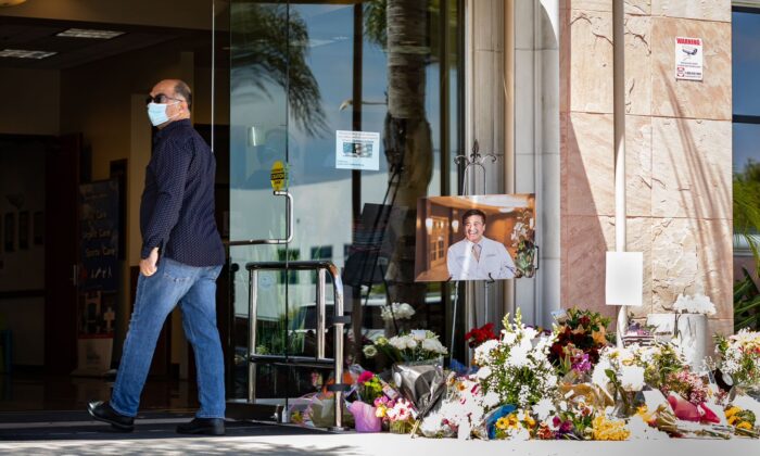 A memorial site for shooting victim Dr. John Cheng sits on display at the entrance of South Bay Medical Group in Aliso Viejo, Calif., on May 17, 2022. (John Fredricks/The Epoch Times)