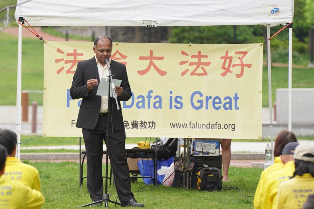Santhosh Krishnamurthy spoke at a rally to celebrate World Falun Dafa Day at Independence National Historical Park in Philadelphia, Pa., on May 15, 2022. (Serena Shi/The Epoch Times)