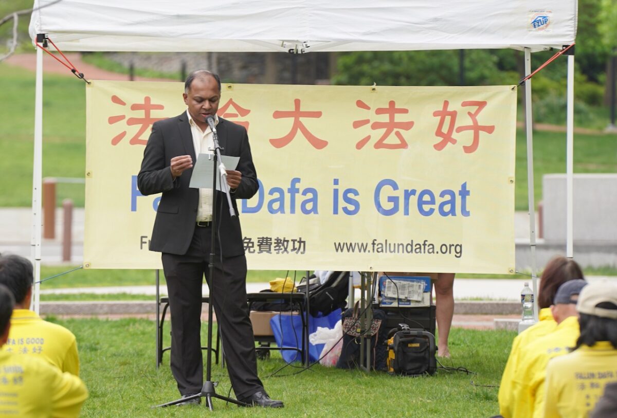Santhosh Krishnamurthy spoke at a rally to celebrate World Falun Dafa Day at Independence National Historical Park in Philadelphia, Pa., on May 15, 2022. (Serena Shi/The Epoch Times)