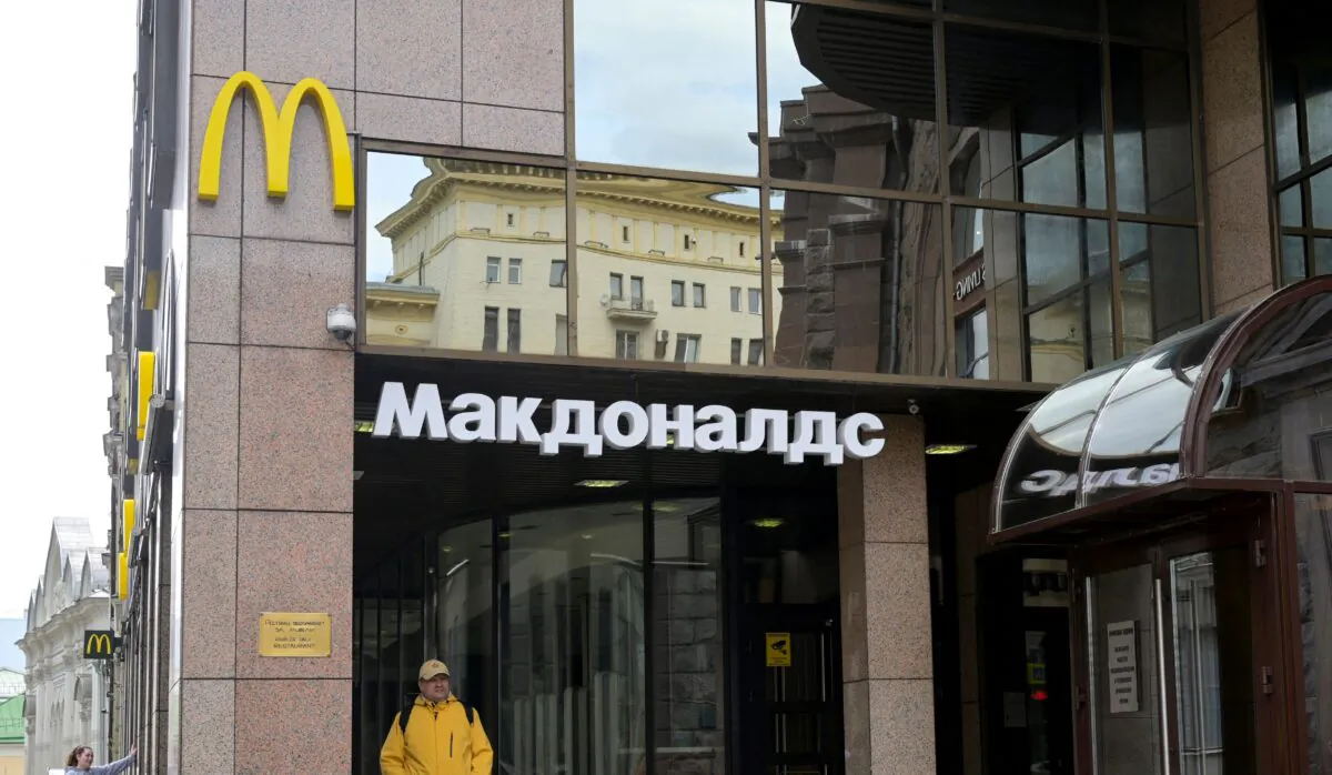 A man walks past a closed McDonald's restaurant in Moscow on May 16, 2022. (Natalia Kolesnikova//AFP via Getty Images)