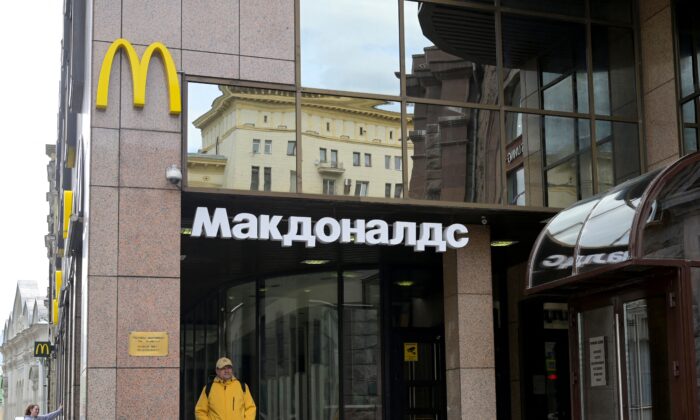 A man walks past a closed McDonald's restaurant in Moscow on May 16, 2022. (Natalia Kolesnikova//AFP via Getty Images)