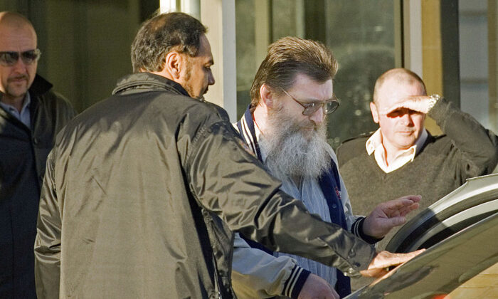 Prison officers escort convicted terrorist Jack Roche (2nd-R) to a waiting taxi as he leaves Casuarina maximum security prison in Western Australia on May 17, 2007 after having served his minumum jail term. (TONY ASHBY/AFP via Getty Images)