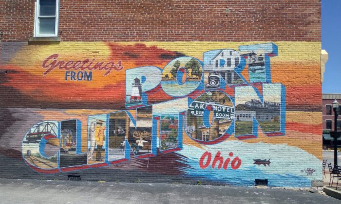 A mural on the side of a building in Port Clinton, Ohio, shows some of the attractions available for tourists. (Michael Sakal/The Epoch Times)