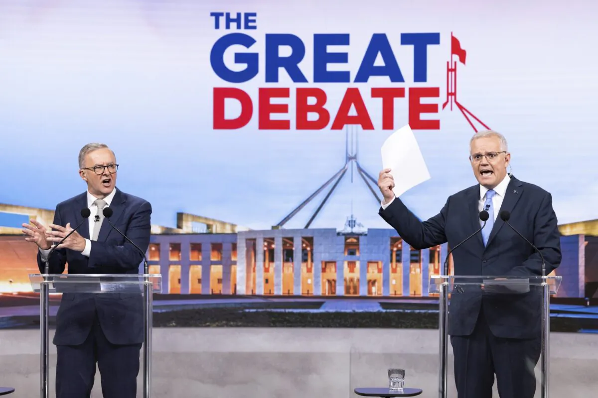 (L-R) Australian opposition leader Anthony Albanese and Australian Prime Minister Scott Morrison debate on live television ahead of the federal election during the second leaders' debate of the 2022 federal election campaign in Sydney, Australia, on May 8, 2022. The Australian federal election will be held on May 21, with Liberal leader Scott Morrison looking to secure a fourth term in power for the Coalition against Labor and opposition leader Anthony Albanese. (Alex Ellinghausen/Pool/Getty Images)