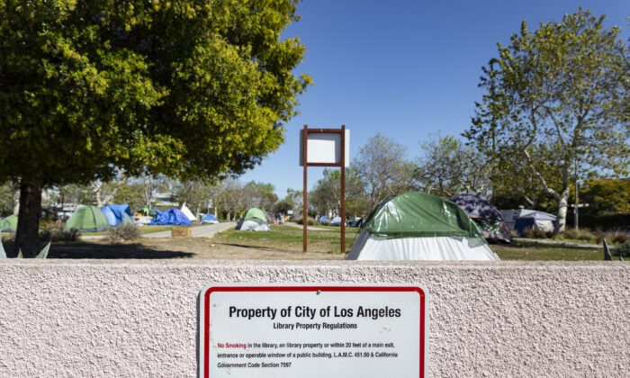 A homeless encampment sits in front of the Abbot Kinney Memorial Branch Library in Venice Beach, Calif., on Feb. 18, 2022. (John Fredricks/The Epoch Times)