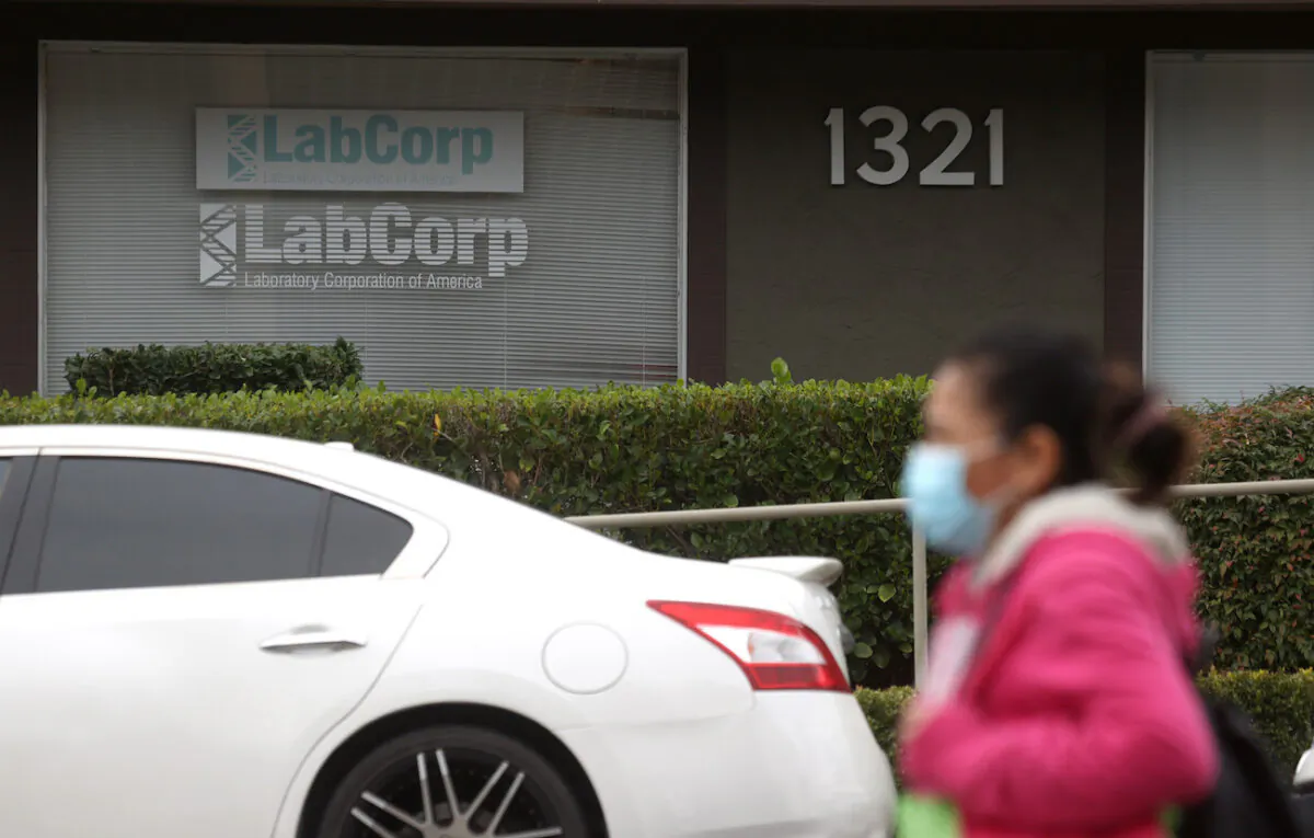 A pedestrian walks by a Labcorp office in Greenbrae, Calif., on Feb. 11, 2021. (Justin Sullivan/Getty Images)
