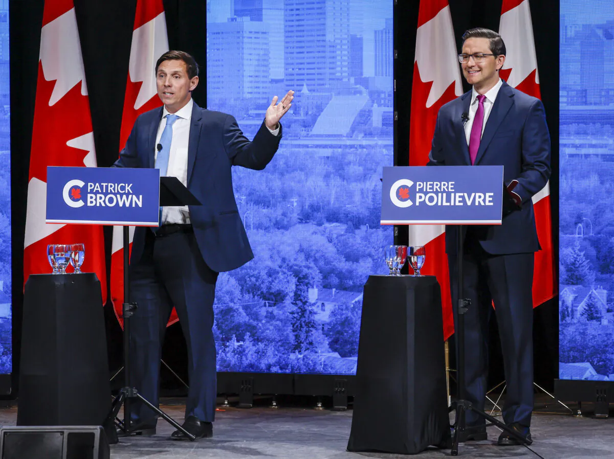 Patrick Brown (L) and Pierre Poilievre trade barbs at the Conservative Party of Canada English leadership debate in Edmonton on May 11, 2022. (The Canadian Press/Jeff McIntosh)