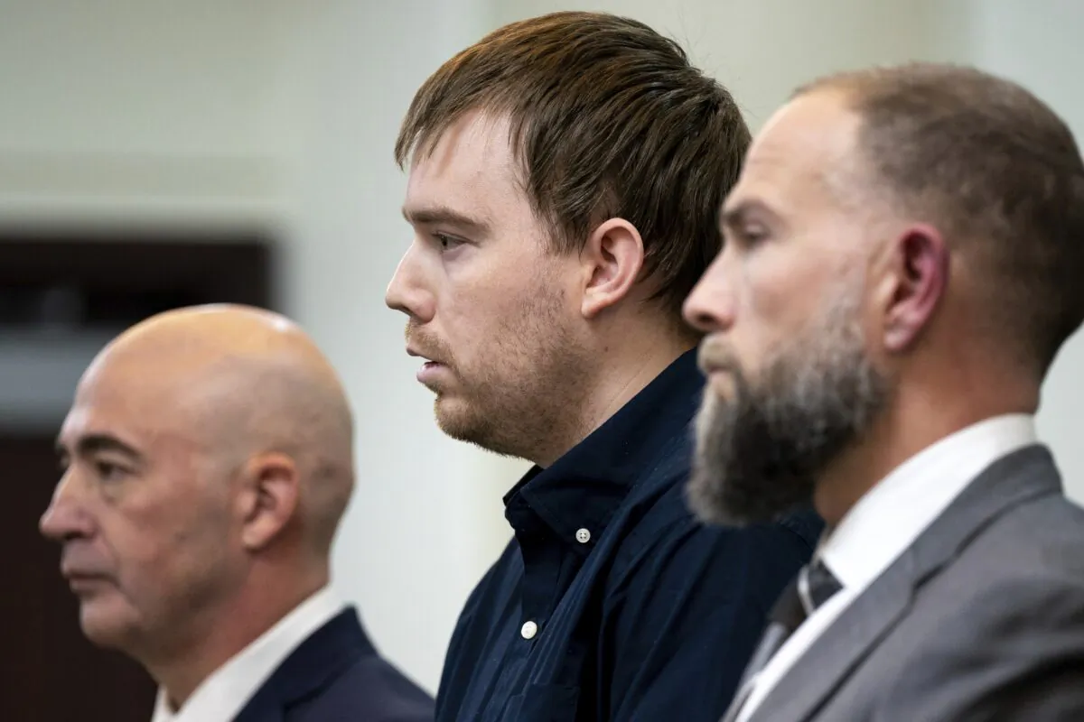 Travis Reinking (C) reacts as the verdict is read during day five of Reinking's murder trial at the Justice A.A. Birch Building in Nashville, Tenn., on Feb. 4, 2022. (Andrew Nelles/The Tennessean via AP, Pool_File)