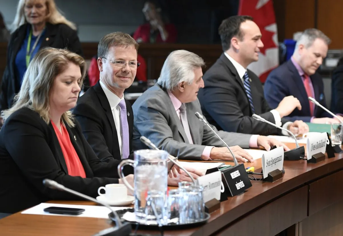Liberal MPs Sherry Romanado, Sven Spengemann, Yves Robillard, Mark Gerretsen and Darren Fisher wait for the start of the Standing Committee on National Defence, Sherry on Parliament Hill in Ottawa on May 16, 2019. (The Canadian Press/Justin Tang)