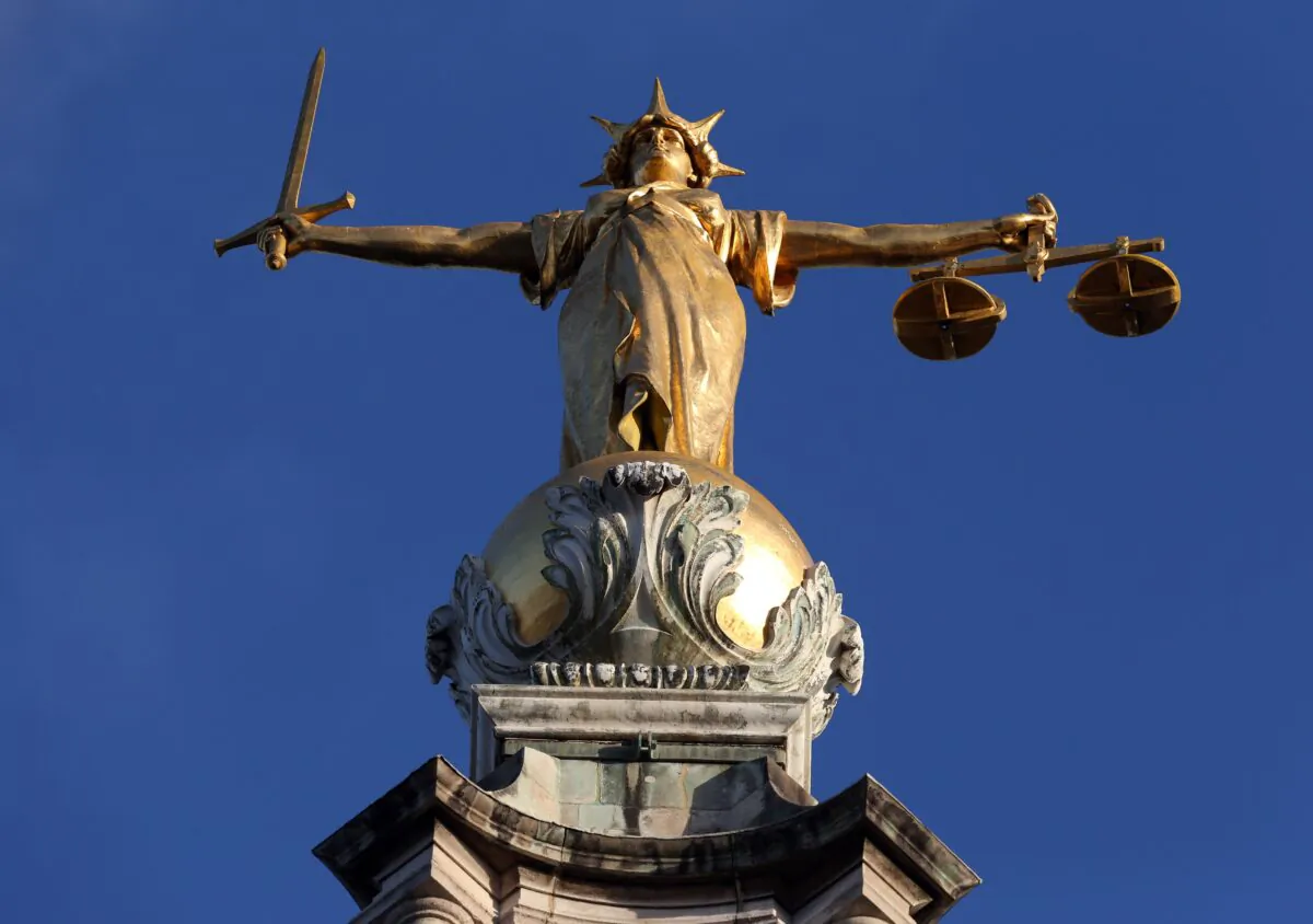 FW Pomeroy's statue of Justice stands atop the Central Criminal Court building, Old Bailey, London on Jan. 8, 2019. (PA Media)