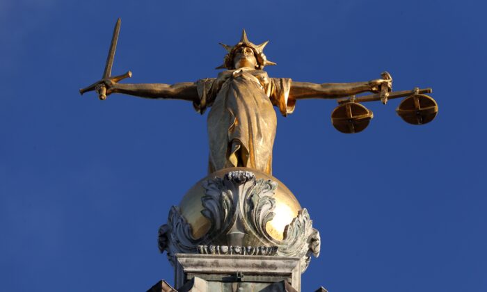 FW Pomeroy's statue of Justice stands atop the Central Criminal Court building, Old Bailey, London on Jan. 8, 2019. (PA Media)