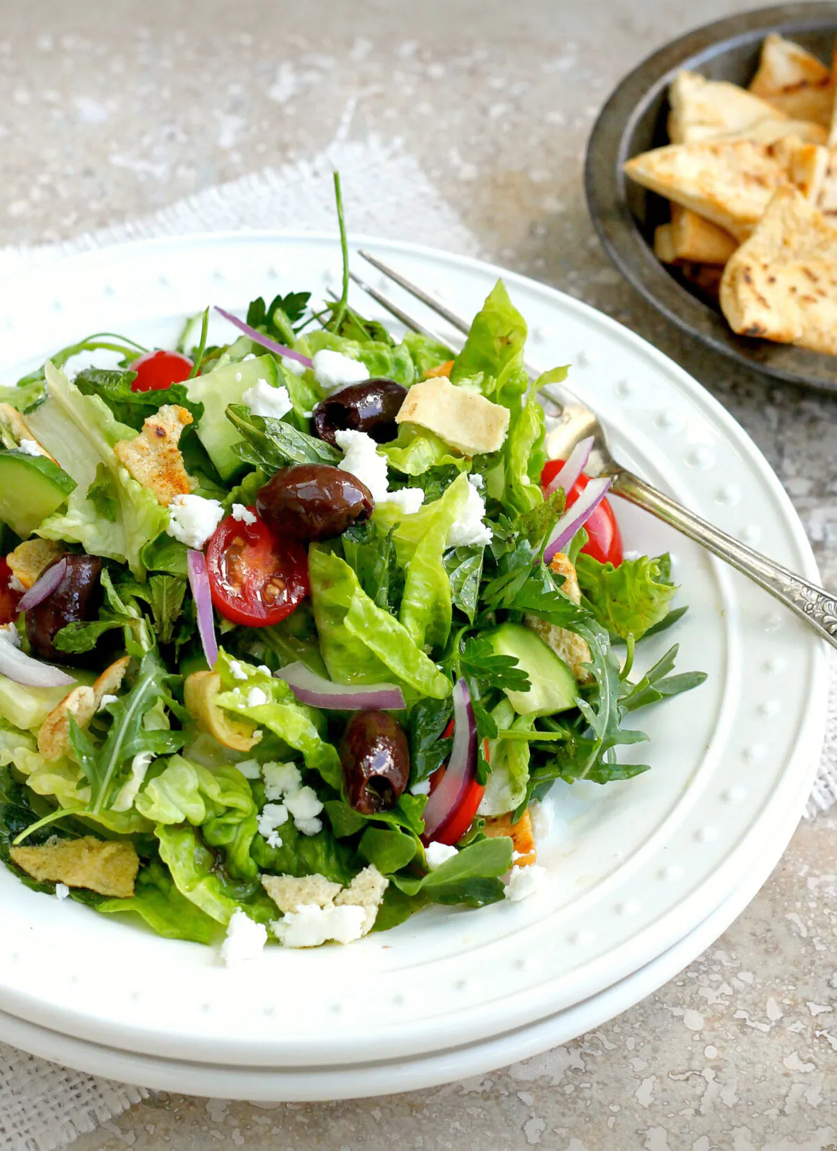 This traditional Levantine salad features crispy pita "croutons" that soak up a puckery lemon and sumac vinaigrette. (Lynda Balslev for Tastefood)