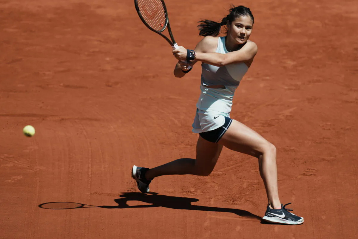 Britain's Emma Raducanu backhands to Aliaksandra Sasnovich of Belarus during their second round match of the French Open tennis tournament at the Roland Garros stadium in Paris on May 25, 2022. (Thibault Camus/AP Photo)