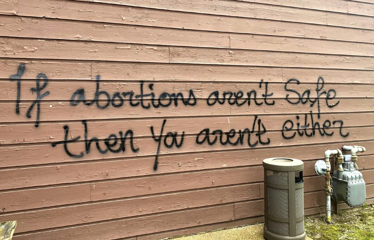 Threatening graffiti is seen on the exterior of Wisconsin Family Action offices in Madison, Wis., on May 8, 2022. (Alex Shur/Wisconsin State Journal via AP)