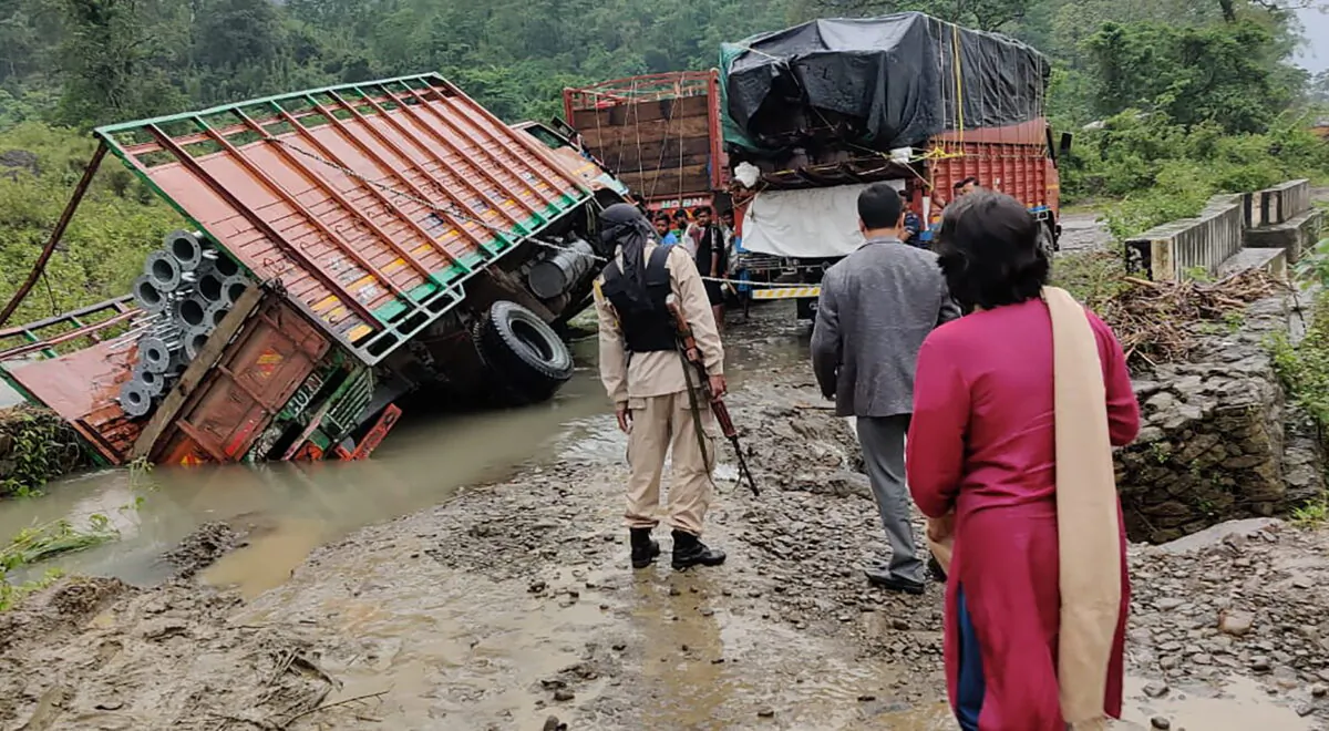 People inspect the area of a landslide after heavy rainfall in Dima Hasao district, in the northeastern Indian state of Assam, on May 16, 2022. (Dima Hasao district administration via AP)