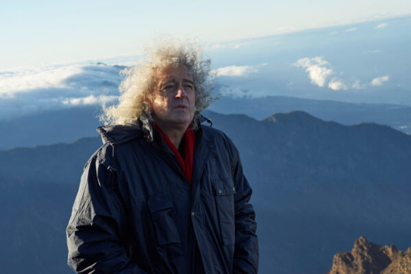 Musician Brian May looks on while shooting a music video on the island of La Palma