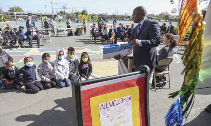 California State Superintendent of Schools Tony Thurmond reads from the book "Red: A Crayon's Story" to second grade students at Nystrom Elementary School in Richmond, Calif., on May 17, 2022. (Justin Sullivan/Getty Images)